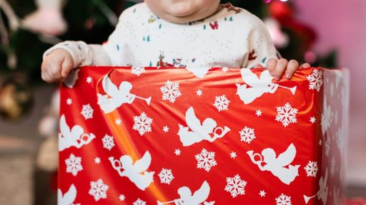 happy child with christmas presents at home