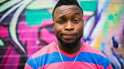 black haired man making face