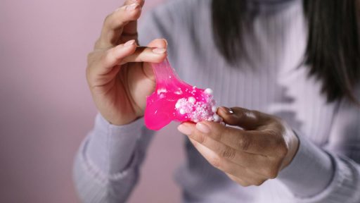 Close-Up Shot of a Person Holding a Pink Slime