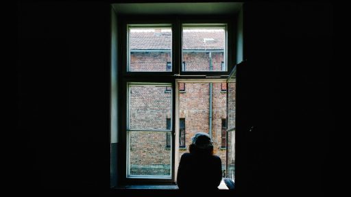 person standing in front of open window