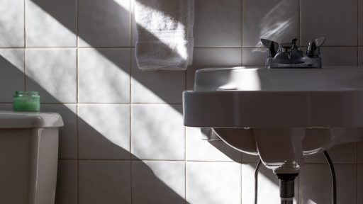 hanged towel beside sink