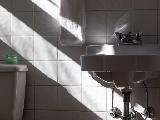 hanged towel beside sink