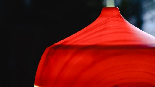 Stylish red wooden diffuser emitting gentle steam, perfect for aromatherapy enthusiasts.