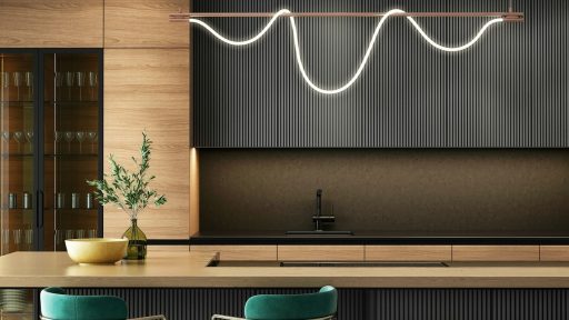 a modern kitchen with a bar and stools