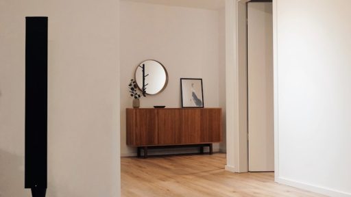 black tower speaker beside white wall