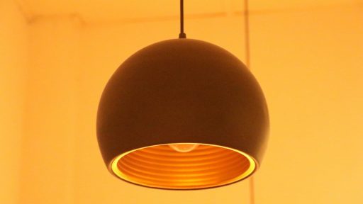 black pendant lamp turned on in room