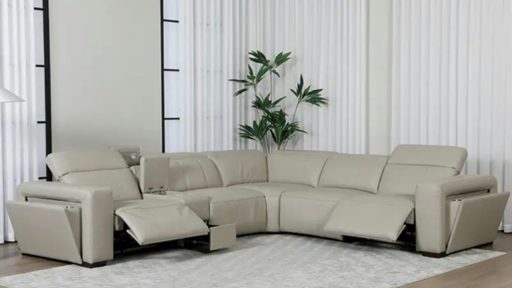 A beige sectional sofa is in a modern living room.