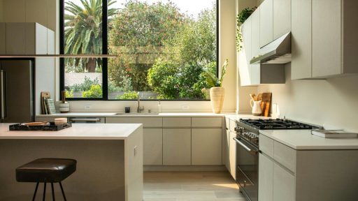 modern kitchen with island and large window