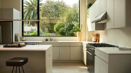 modern kitchen with island and large window