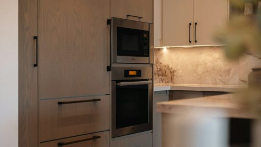 Modern kitchen with built-in oven and microwave