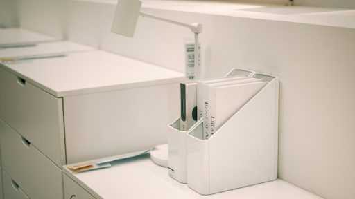 White office organizer with files on desk