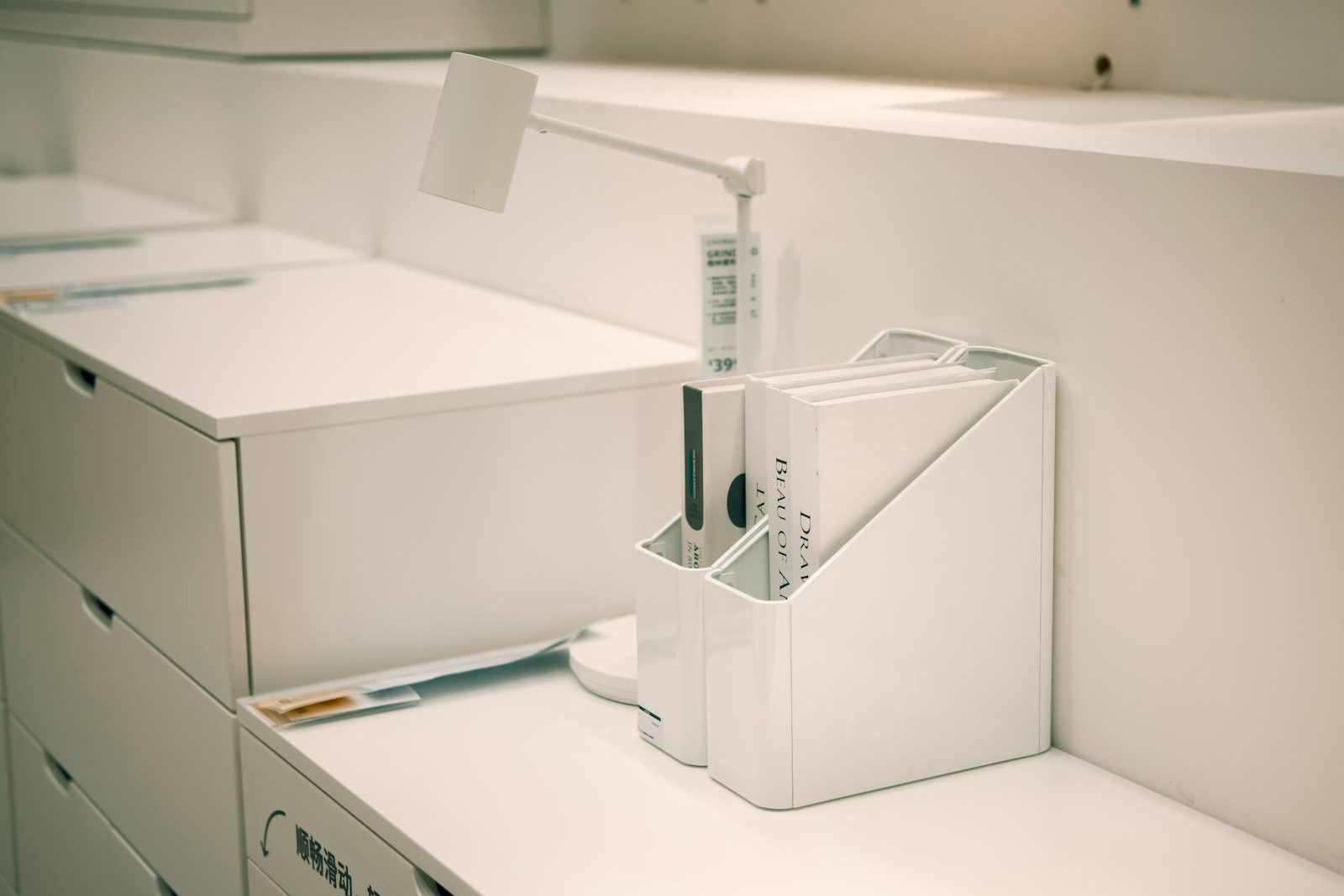 White office organizer with files on desk